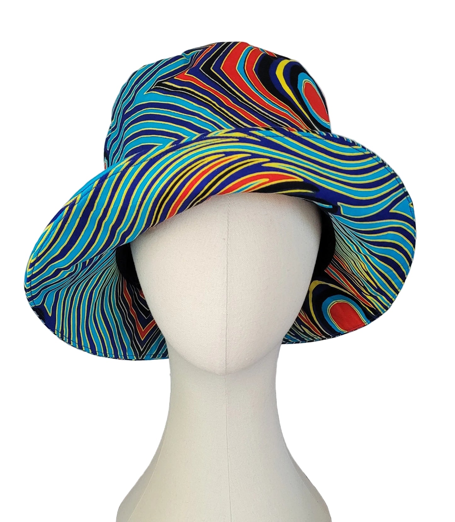 A wide-brimmed bucket hat with a vibrant, multicolored wavy stripe pattern, displayed on a white mannequin head.