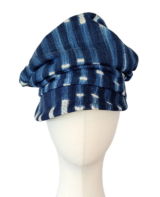 Blue and white patterned crushable hat on a mannequin head against a white background