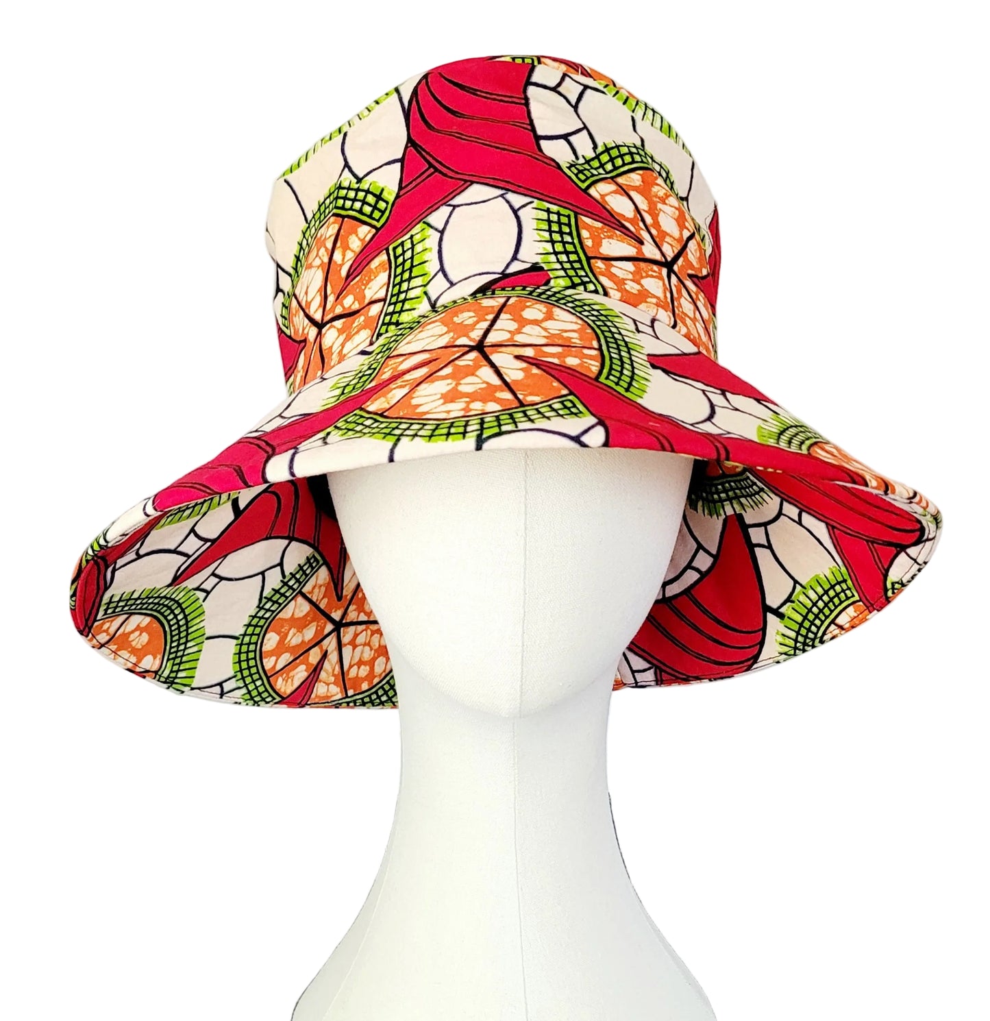 A multicolor African wax print bucket hat with a red, orange, green, and white pattern, displayed on a white mannequin head.
